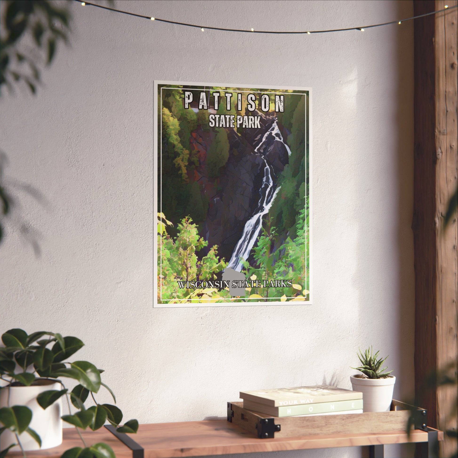 CCC styled poster depicting Big Manitou Falls at Pattison State Park.  Displayed on a wall above a shelf.