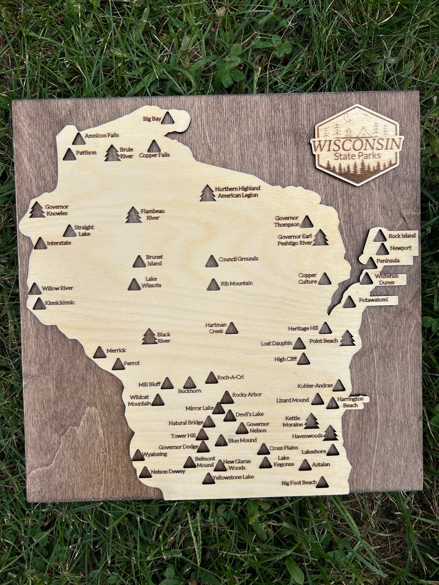 State Park Travel map in Wisconsin shape on a walnut-colored backboard. 