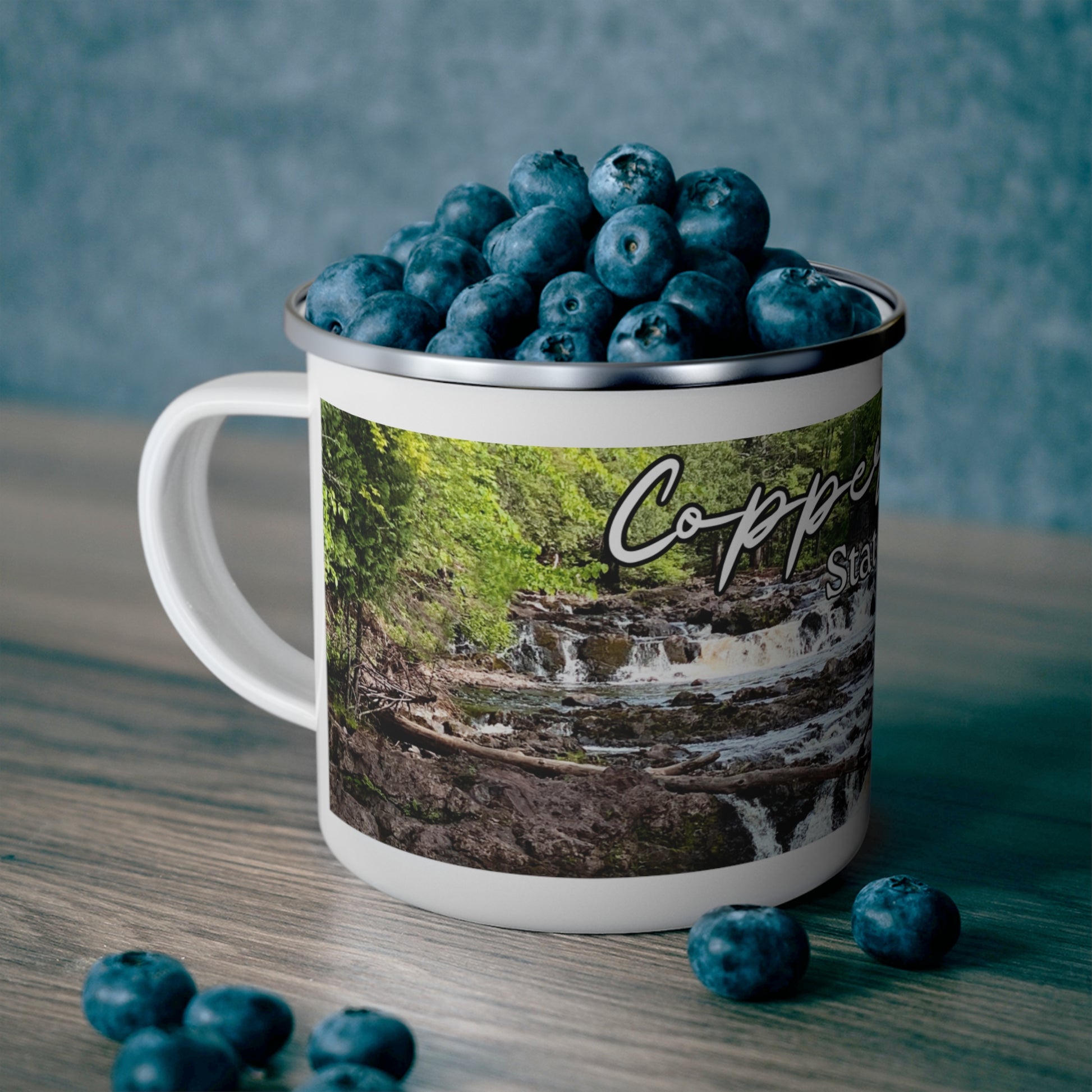 White enamel camper mug depicting Tyler Forks Cascades and the text “Copper Falls State Park.”