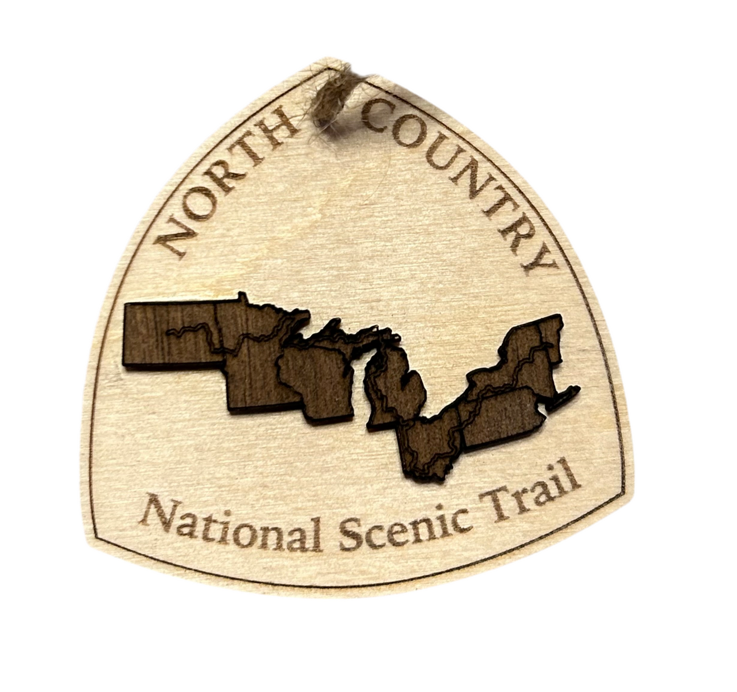 Wood ornament in the shape of the national trail's icon, with a walnut-colored North Dakota, Minnesota, Wisconsin, Michigan, Ohio, Pennsylvania, New York, and Vermont Shaped center piece depicting the North Country Trail Route.  Ornament contains the text "North Country National Scenic Trail". 