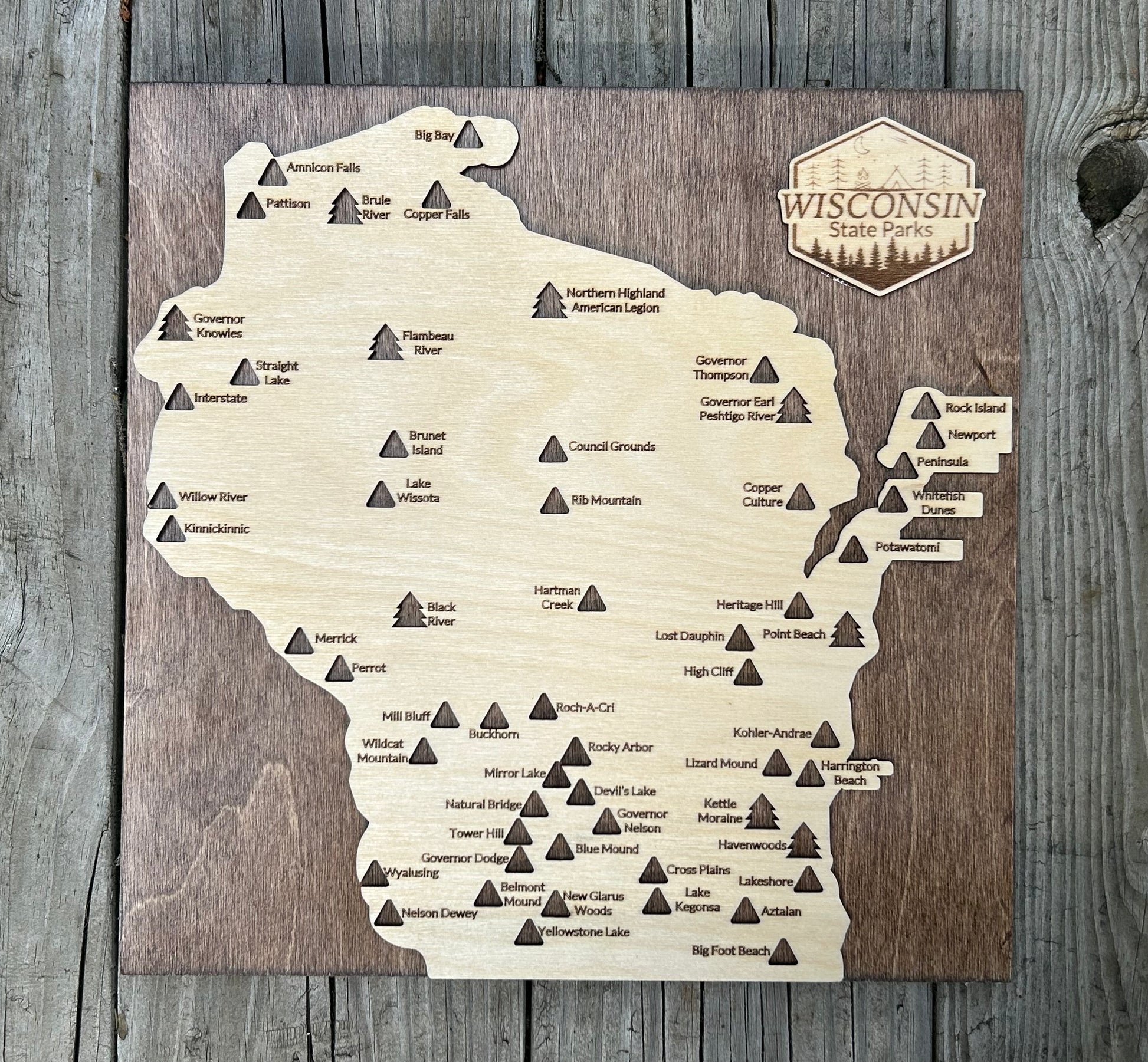 State Park Travel map in Wisconsin shape on a walnut-colored backboard. 